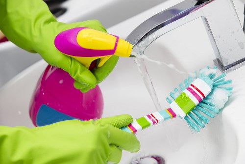 Routine cleaning of kitchen and bathroom surfaces in a central London property