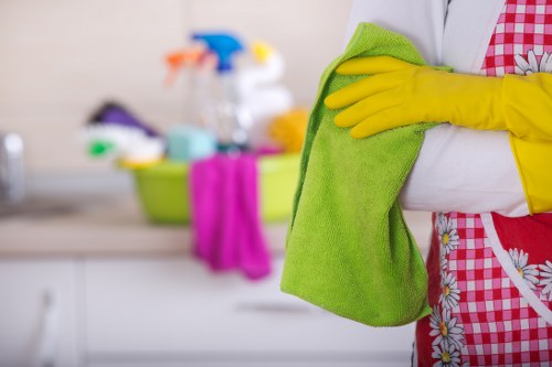 Cleaner refreshing a bathroom in a Westminster apartment before move-in