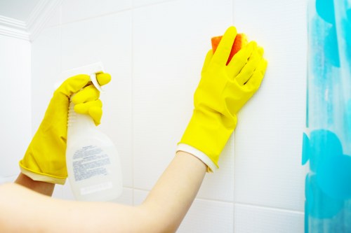 Professional short-let cleaner preparing a guest-ready kitchen in Westminster